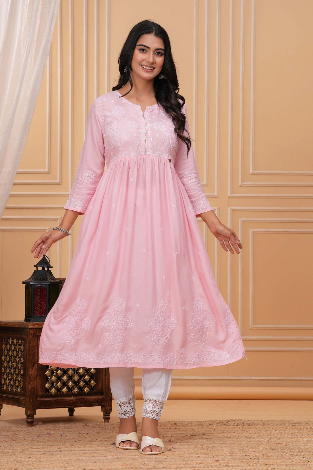 Light pink cotton anarkali kurta with white hand embroidery featuring floral patterns, paired with white pants