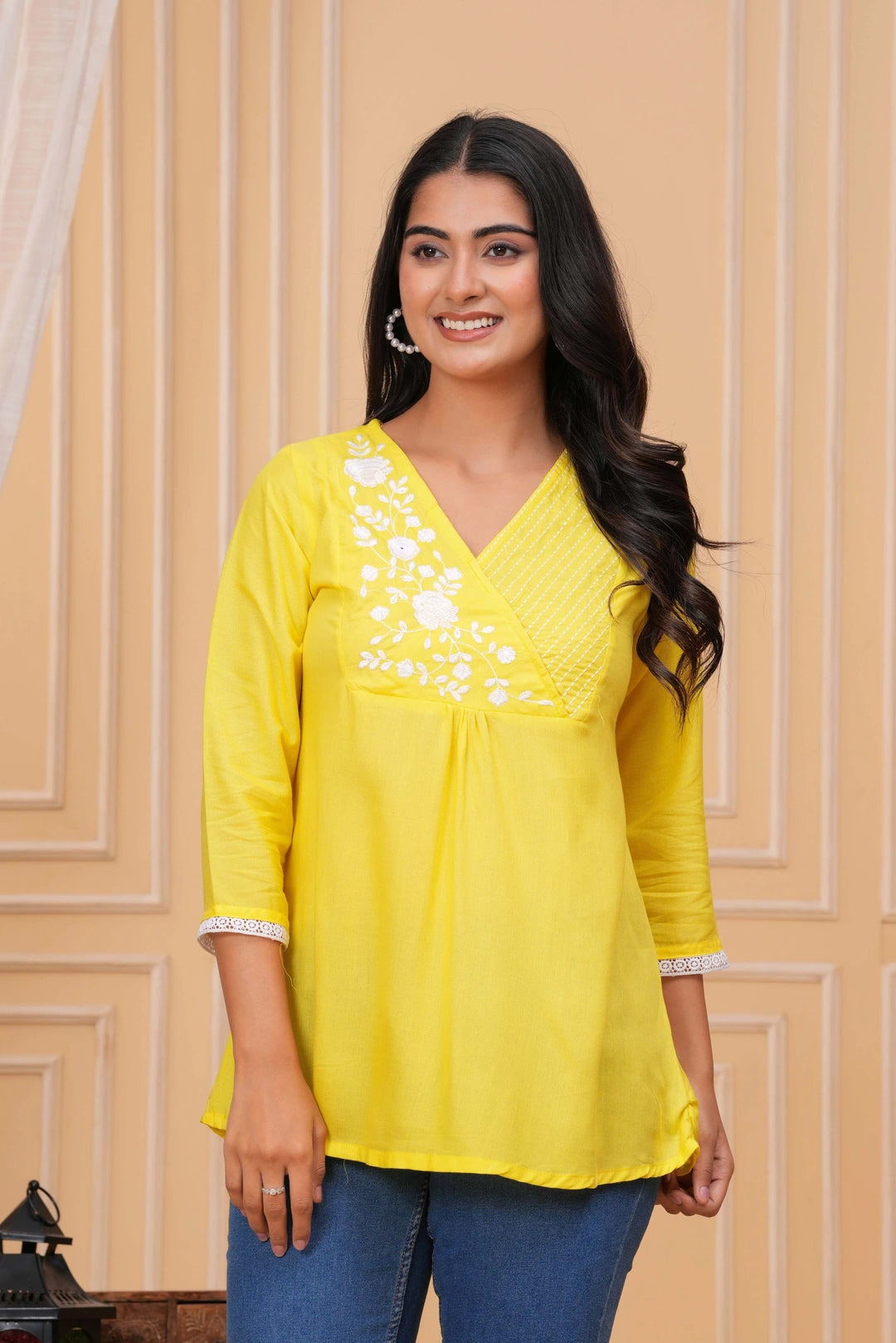 Bright yellow cotton tunic with white floral and striped embroidery on V-neck and delicate white lace trim on sleeves