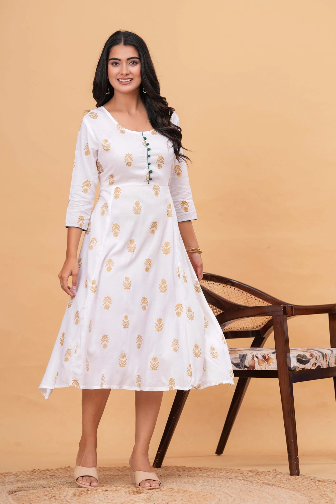 White cotton kurta with golden handblock printed floral motifs and green button details